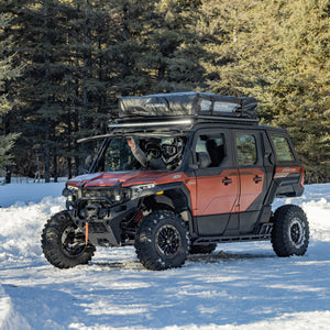 Polaris Xpedition ADV 5 in matte orange rust with tip-out glass windshield on the trail