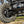 SuperATV Xpedition A-arm kit showing adjustable camber pivot block detail