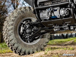 SuperATV Xpedition A-arm kit showing adjustable camber pivot block detail
