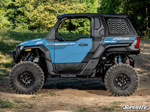 SuperATV 3 inch lift kit spacers installed on Polaris Xpedition suspension