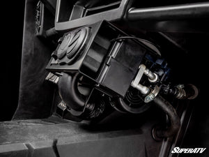 Side view of the SuperATV cab heater and hoses mounted under the Polaris Ranger XP 1000 dash