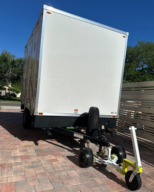 TRAILER-TUG MONSTER-TUG towing device attached to a trailer, designed for heavy-duty towing and transport.