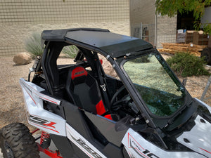 Black powder-coated aluminum roof with billet mounts and stainless steel bolts for Polaris RS1 models from 2018 to 2022