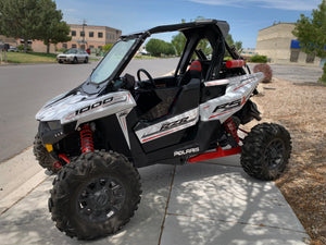 Polaris RZR RS1 with the UTV Zilla glass windshield installed, full machine shown from the front