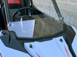 UTVZILLA clear polycarbonate half windshield for Polaris RS1 with billet mounts and quick-release knobs