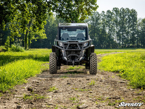 SuperATV MaxDrive power flip glass windshield on a Can-Am Commander, angle view