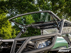SuperATV MaxDrive power flip glass windshield on a Can-Am Commander, installed close-up