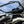 SuperATV flip windshield on a Can-Am Maverick R, detail view