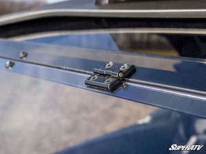 SuperATV flip windshield on a Can-Am Maverick R, hardware detail