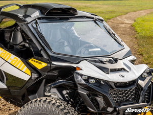 SuperATV glass windshield on a Can-Am Maverick R, installed close-up