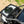 SuperATV flip down glass windshield on a Can-Am Maverick Sport, detail view