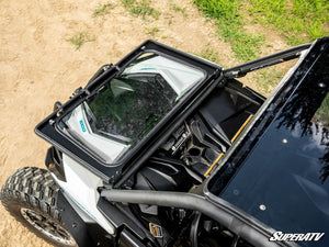 SuperATV flip down glass windshield on a Can-Am Maverick Sport, detail view