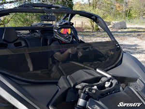 SuperATV half windshield on a Can-Am Maverick X3, installed close-up