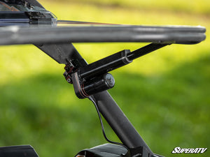 SuperATV MaxDrive Power Flip windshield on a Can-Am Maverick X3, detail view