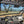 SuperATV MaxDrive power flip glass windshield on a CFMOTO UForce 1000, angle view