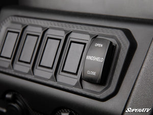 SuperATV MaxDrive power flip windshield on a CFMOTO UForce 1000, detail view