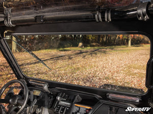 SuperATV glass windshield on a Honda Pioneer 1000, installed close-up