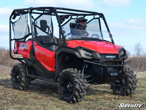 SuperATV half windshield on a Honda Pioneer 1000, installed close-up