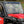 SuperATV MaxDrive power flip windshield on a Honda Pioneer 1000, installed close-up