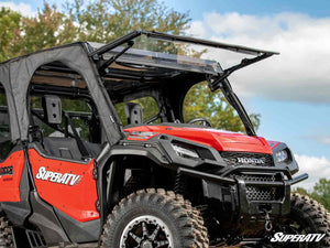 SuperATV MaxDrive power flip windshield on a Honda Pioneer 1000, cab view