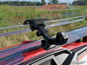 SuperATV flip windshield on a Honda Pioneer 500, installed close-up
