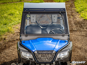 SuperATV glass windshield on a Honda Pioneer 500, installed close-up