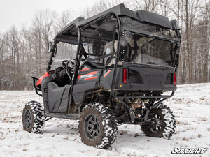 SuperATV rear windshield on a Honda Pioneer 700-4, angle view