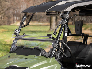 SuperATV flip windshield on a Honda Pioneer 700, installed close-up