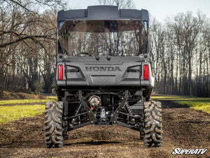 SuperATV rear windshield on a Honda Pioneer 700, angle view