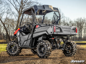SuperATV rear windshield on a Honda Pioneer 700, installed close-up