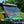 SuperATV flip windshield on a John Deere Gator, angle view