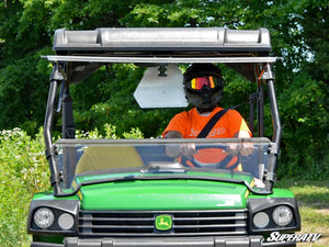 SuperATV flip windshield on a John Deere Gator, cab view