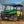 SuperATV flip windshield on a John Deere Gator XUV 590, angle view