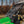 SuperATV flip windshield on a John Deere Gator XUV 590, installed close-up