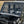 SuperATV MaxDrive power flip windshield on a Kawasaki Mule Pro, angle view