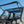 SuperATV MaxDrive power flip windshield on a Kawasaki Mule Pro, installed close-up