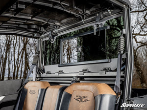SuperATV glass sliding rear windshield on a Kawasaki Ridge, side view