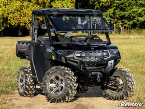 SuperATV MaxDrive power flip glass windshield on a Polaris Ranger, installed close-up