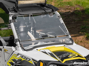 SuperATV flip windshield on a Polaris RZR, installed close-up
