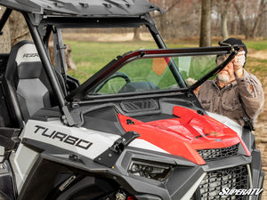 SuperATV flip down glass windshield on a Polaris RZR, installed close-up