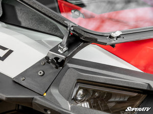 SuperATV flip down glass windshield on a Polaris RZR, mounted view