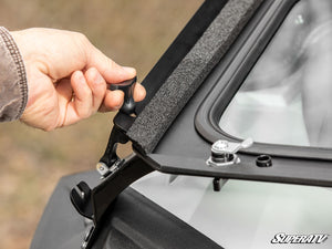 SuperATV flip down glass windshield on a Polaris RZR, hardware detail