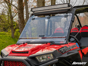 SuperATV flip windshield on a Polaris RZR, angle view