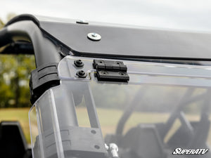 SuperATV flip windshield on a Polaris RZR Pro XP, installed close-up