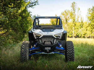 SuperATV half windshield on a Polaris RZR Pro XP, installed close-up