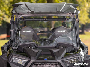 SuperATV MaxDrive power flip windshield on a Polaris RZR XP 1000, installed close-up