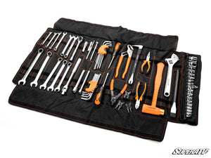 SuperATV universal ATV UTV roll-up tool kit laid out with wrenches and sockets