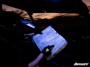 Assault Industries UTV map light mounted to a side-by-side roll cage tube