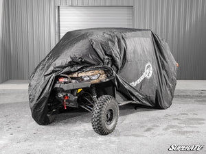 SuperATV universal weatherproof UTV cover fitted over a parked side-by-side