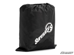 SuperATV universal UTV cover shielding a side-by-side from sun rain and mold